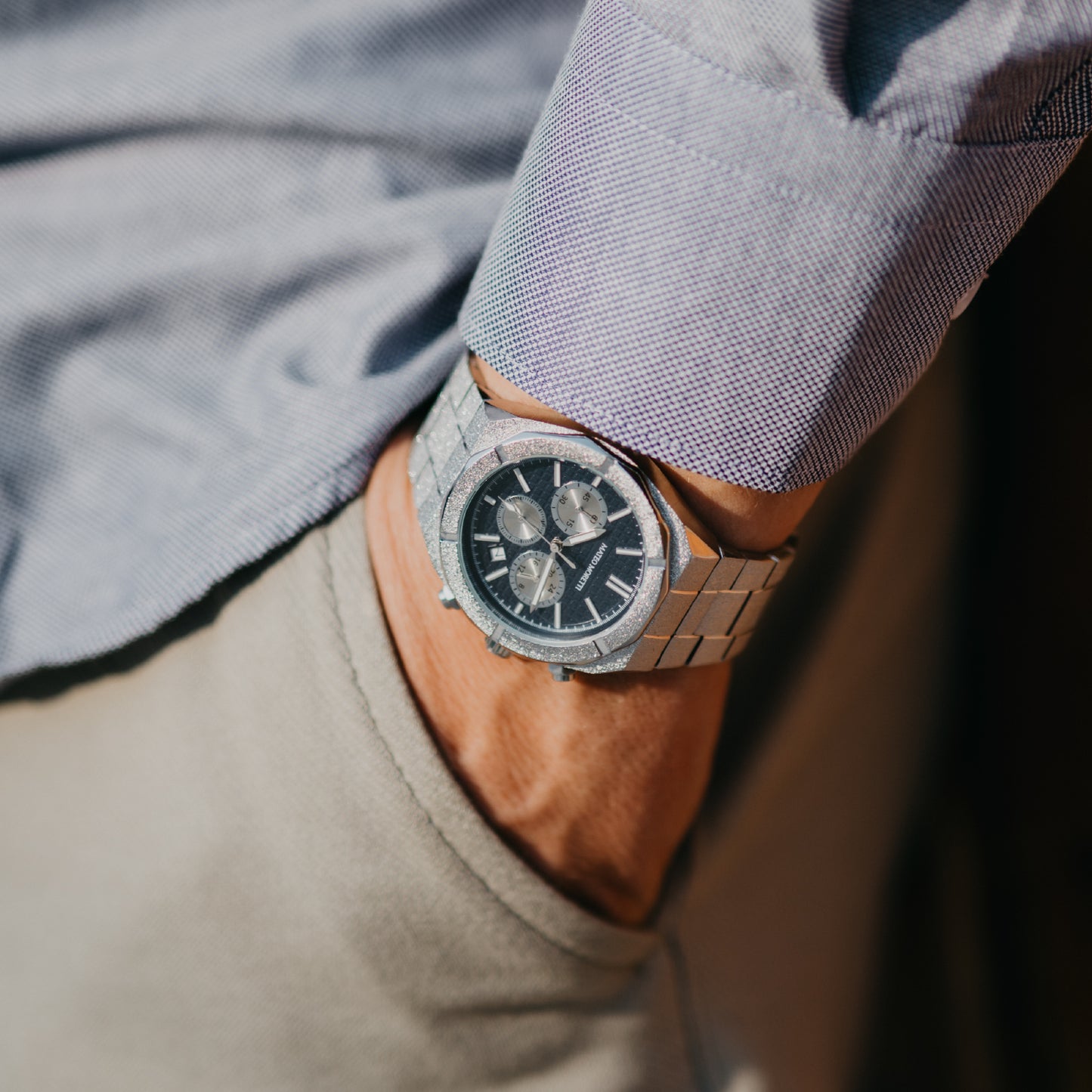 Lifestyle wrist photo of Mateo Moretti Basento Argento men’s watch with silver bracelet and blue chronograph dial