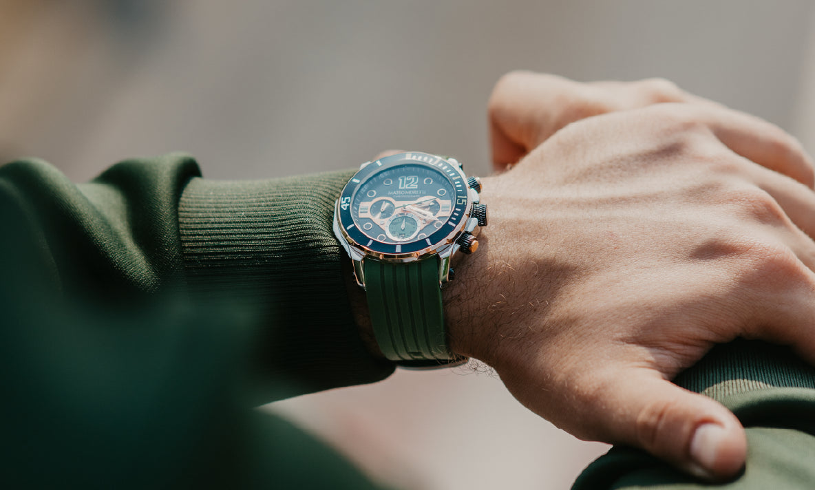Mateo Moretti chronograph with green rubber strap on wrist outdoors.”