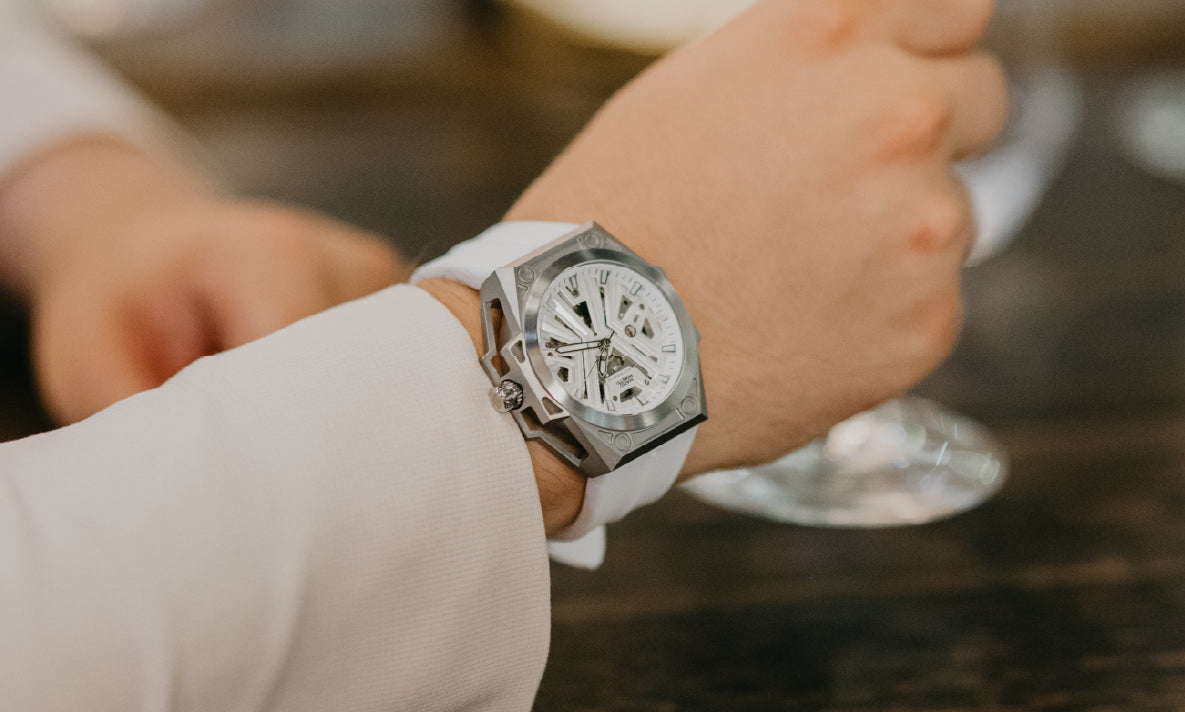 Mateo Moretti skeleton-dial watch with white strap in a formal setting